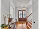 Bright foyer featuring hardwood floors, stylish lighting, and a staircase at 2615 Bedford Ave, Raleigh, NC 27607