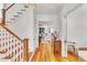 Bright foyer featuring hardwood floors, stylish lighting, and a staircase at 2615 Bedford Ave, Raleigh, NC 27607
