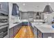 Contemporary kitchen featuring a large island, stainless appliances, and custom cabinetry at 2615 Bedford Ave, Raleigh, NC 27607