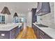 This open kitchen boasts a large island, stainless appliances, and seamless flow to the rest of the home at 2615 Bedford Ave, Raleigh, NC 27607
