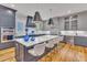Gourmet kitchen boasts an island, stainless steel appliances, and custom cabinetry at 2615 Bedford Ave, Raleigh, NC 27607