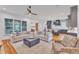 Spacious living room leads to a modern kitchen with a large island and stylish finishes at 2615 Bedford Ave, Raleigh, NC 27607