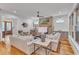 Bright and airy living room featuring a fireplace, hardwood floors, and stylish furnishings at 2615 Bedford Ave, Raleigh, NC 27607