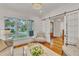 Bright living room features large windows, hardwood floors, and stylish sliding barn doors at 2615 Bedford Ave, Raleigh, NC 27607