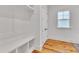 A clean and functional mudroom space featuring a bench and cubbies for storage at 2615 Bedford Ave, Raleigh, NC 27607