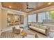 Relaxing screened-in porch with stylish wicker seating, overhead fan, and wood ceiling at 2615 Bedford Ave, Raleigh, NC 27607