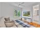 Relaxing sitting room with a sofa, TV, and a view of a bright window at 2615 Bedford Ave, Raleigh, NC 27607