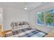 Sitting room features a comfortable couch, stylish rug and a large window at 2615 Bedford Ave, Raleigh, NC 27607