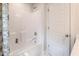 Clean bathroom with tile shower and tub, and a white door at 269 Ivy Ridge Rd, Chapel Hill, NC 27516