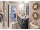Charming bathroom with double sinks, decorative mirrors, and stylish wallpaper at 269 Ivy Ridge Rd, Chapel Hill, NC 27516
