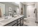 Elegant bathroom with double sink vanity, chrome fixtures, and decorative wall accents at 269 Ivy Ridge Rd, Chapel Hill, NC 27516