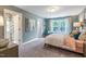 Inviting bedroom features soft tones, natural light, and views to the exterior at 269 Ivy Ridge Rd, Chapel Hill, NC 27516