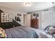 Cozy bedroom showcasing a chest of drawers, stylish decor, and a unique accent wall at 269 Ivy Ridge Rd, Chapel Hill, NC 27516