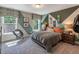 Stylish bedroom featuring unique geometric accent wall, modern decor, and a comfortable bed at 269 Ivy Ridge Rd, Chapel Hill, NC 27516