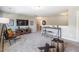 Open bonus room offers a relaxed atmosphere with media console, table and chairs at 269 Ivy Ridge Rd, Chapel Hill, NC 27516