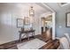 Elegant entryway featuring hardwood floors, wainscoting, a rustic console table, and decorative artwork at 269 Ivy Ridge Rd, Chapel Hill, NC 27516