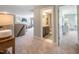 Upstairs hallway leading to a bathroom with dark vanity and decorative mirrors at 269 Ivy Ridge Rd, Chapel Hill, NC 27516