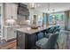Modern kitchen boasts an expansive island, elegant lighting, and stainless steel appliances at 269 Ivy Ridge Rd, Chapel Hill, NC 27516
