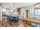 Stylish kitchen with island seating, stainless steel appliances, and an adjacent dining area for casual meals at 269 Ivy Ridge Rd, Chapel Hill, NC 27516