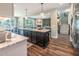 Open-concept design connects kitchen to living room with cozy fireplace and natural light at 269 Ivy Ridge Rd, Chapel Hill, NC 27516