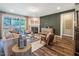 Stylish living room featuring a cozy fireplace, comfortable seating, and access to an outdoor deck at 269 Ivy Ridge Rd, Chapel Hill, NC 27516