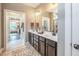 The main bathroom features double sink vanity and a doorway leading to a closet at 269 Ivy Ridge Rd, Chapel Hill, NC 27516