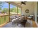 Relaxing screened porch with comfortable seating and a scenic outdoor view at 269 Ivy Ridge Rd, Chapel Hill, NC 27516