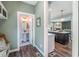 A quaint powder room features patterned wallpaper, a pedestal sink, and an oval mirror at 269 Ivy Ridge Rd, Chapel Hill, NC 27516