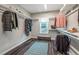 Large walk-in closet with clothing racks, shelving, a window and wood-look flooring at 269 Ivy Ridge Rd, Chapel Hill, NC 27516