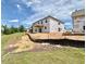 Rear exterior view of a new construction home featuring windows and unfinished yard at 27 Spring Crest Dr # 69, Angier, NC 27501