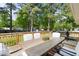 Outdoor deck with patio dining set and a grill, perfect for outdoor entertaining at 2702 Richwood Rd, Durham, NC 27705