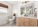 Bright bathroom with a modern vanity, stylish mirror, and updated fixtures at 2702 Richwood Rd, Durham, NC 27705