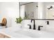 Bathroom featuring a white quartz countertop, black hardware, and a modern sink at 2702 Richwood Rd, Durham, NC 27705