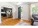 Welcoming entryway with hardwood floors, a glimpse of the dining area, and natural light at 2702 Richwood Rd, Durham, NC 27705