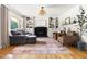 Inviting living room with hardwood floors, built-in bookshelves and a cozy fireplace at 2702 Richwood Rd, Durham, NC 27705