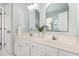 Bright bathroom featuring a double sink vanity with sleek hardware and a decorative plant at 2728 Cherry Field Dr, Raleigh, NC 27603