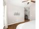 Bright bedroom featuring hardwood floors, a ceiling fan and large windows at 2728 Cherry Field Dr, Raleigh, NC 27603
