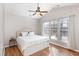 Bright bedroom featuring hardwood floors, and large windows at 2728 Cherry Field Dr, Raleigh, NC 27603