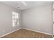 Bedroom featuring neutral walls, a ceiling fan and a large window at 2728 Cherry Field Dr, Raleigh, NC 27603