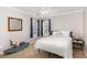 Bright bedroom featuring neutral walls, a ceiling fan and a rocking horse at 2728 Cherry Field Dr, Raleigh, NC 27603