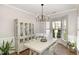 Bright dining room with hardwood floors, chandelier, and natural light at 2728 Cherry Field Dr, Raleigh, NC 27603