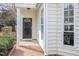 Inviting entryway with brick walkway, decorative front door, and sidelight window at 2728 Cherry Field Dr, Raleigh, NC 27603