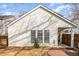 A view of the home's exterior from the backyard showing the patio and lawn at 2728 Cherry Field Dr, Raleigh, NC 27603