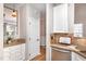 Modern kitchen featuring granite counters, white cabinets, and stainless steel appliances at 2728 Cherry Field Dr, Raleigh, NC 27603