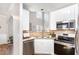 Modern kitchen with stainless steel appliances, white cabinetry, and stone backsplash at 2728 Cherry Field Dr, Raleigh, NC 27603