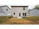Rear of a two story house, vinyl siding, grassy yard and proximity to neighboring houses at 2800 Elsa Dr, Raleigh, NC 27610