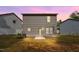Two-story home featuring vinyl siding and a backyard, set against a backdrop of neighboring houses at 2800 Elsa Dr, Raleigh, NC 27610