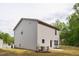 Two-story home with vinyl siding overlooking a well-maintained backyard and bordering the woods at 2800 Elsa Dr, Raleigh, NC 27610