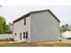 Exterior view of a two-story home with vinyl siding, spacious backyard, and proximity to trees at 2800 Elsa Dr, Raleigh, NC 27610