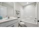Bathroom featuring a single sink vanity, tiled floors, and shower-tub combo at 2800 Elsa Dr, Raleigh, NC 27610